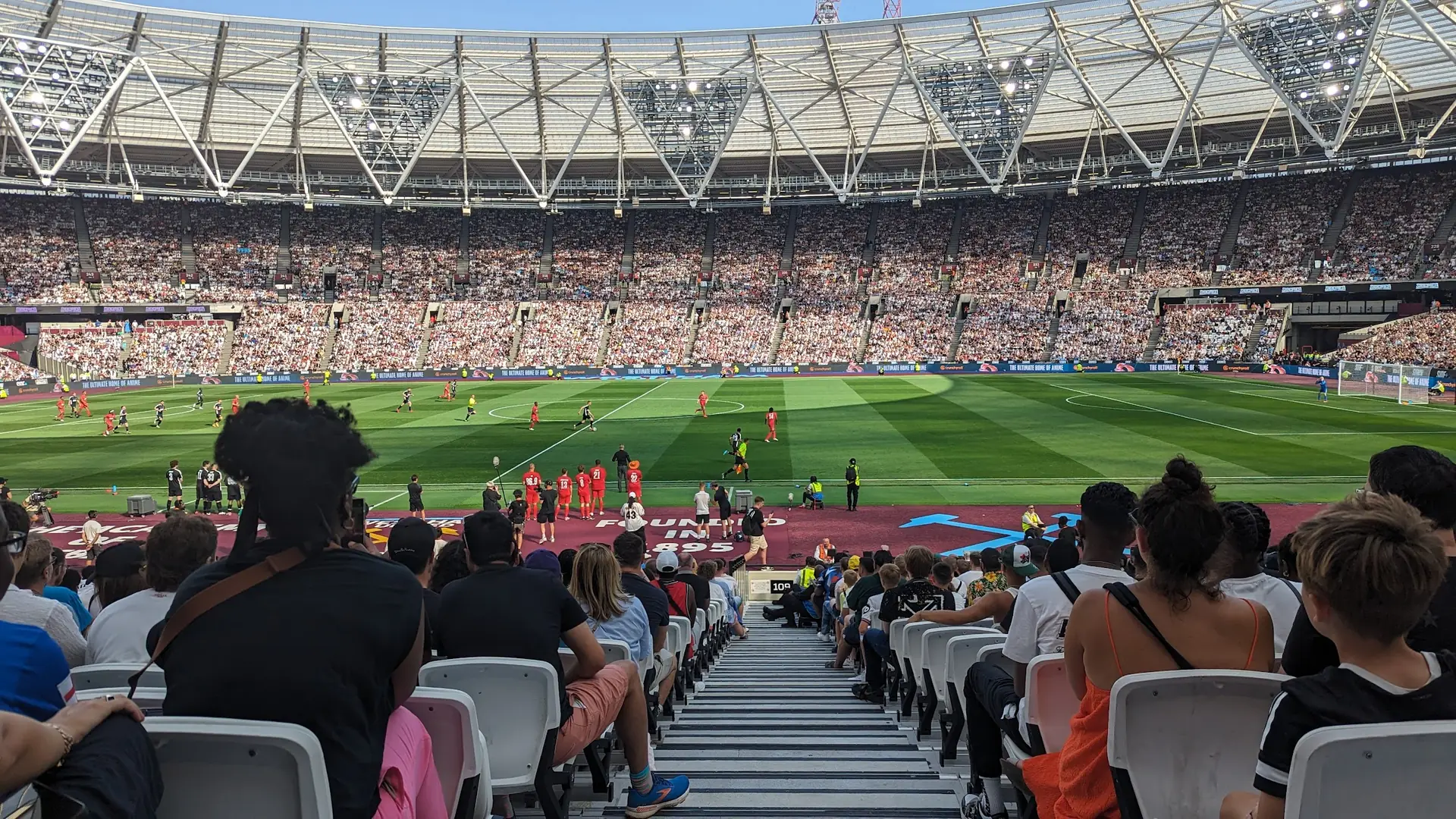 A packed London Stadium watching a match